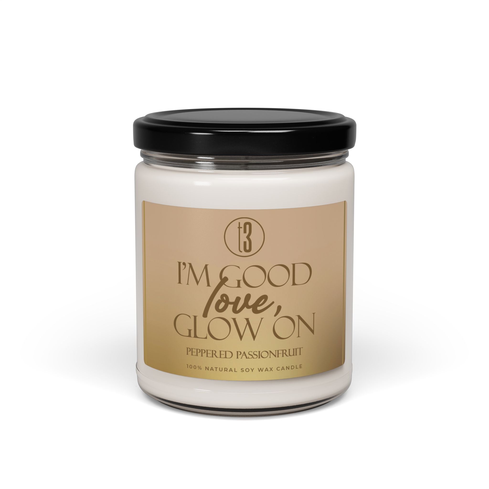 “I’m Good, Love, Glow On” aromatherapy candle from T3 Wellness, shown in three views: lit with a moody background, and unlit with lid on and off. Housed in a glass jar with a beige label and black text, this hand-poured candle features a citrus-forward fragrance blend of juicy orange, melon, pineapple, jasmine, and passionfruit. Designed for emotional grounding, relaxation, and self-care rituals. Available now at teatimewithtoniya.com.