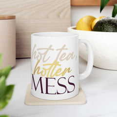 11oz ceramic mug with Hot Tea, Hotter Mess slogan, BPA-free and microwave safe with comfortable C-handle.
