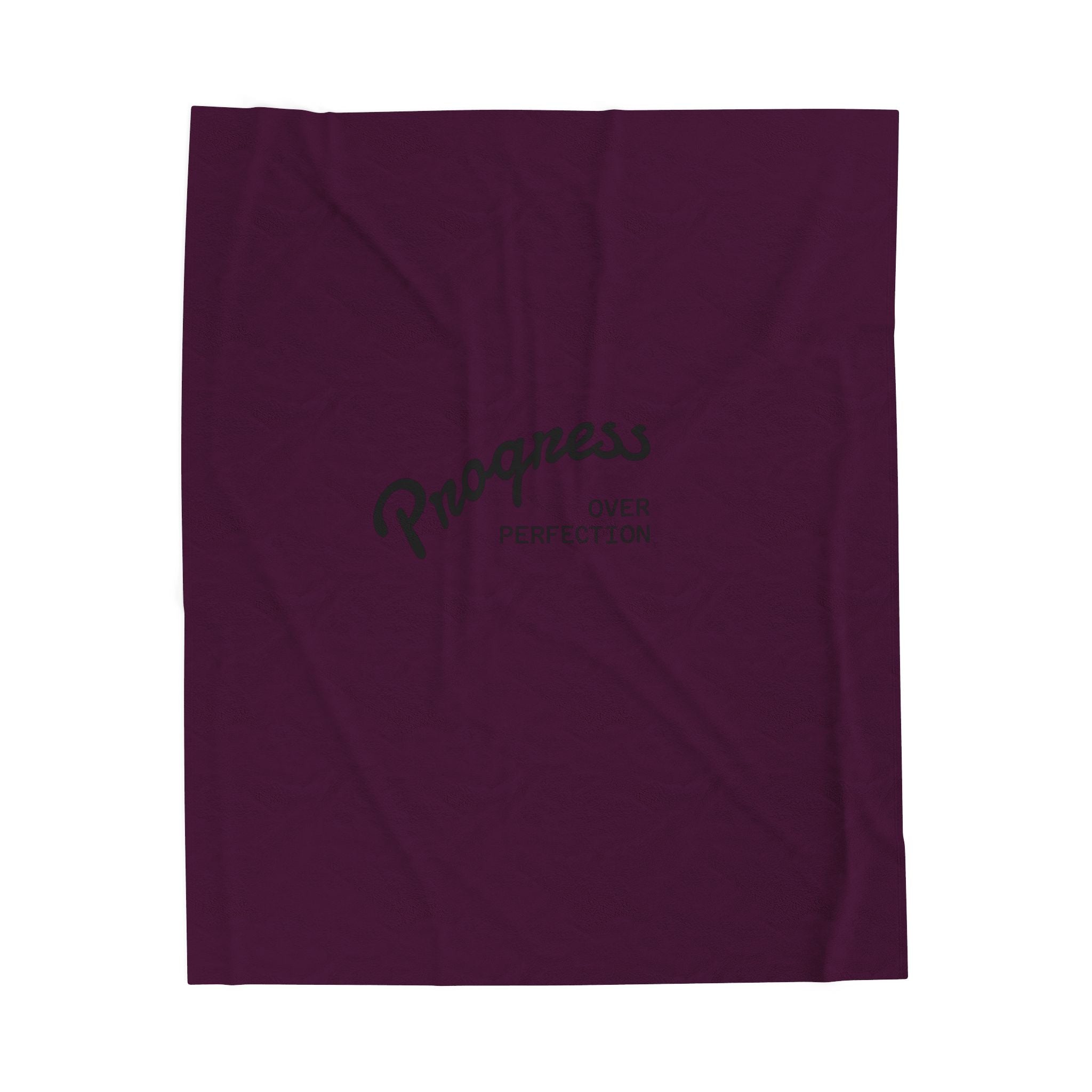 Purple plush blanket titled Progress over Perfection, crafted from soft polyester with durable topstitching for emotional comfort and warmth."