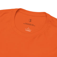 Close-up of an orange t-shirt with text and branding on a white background