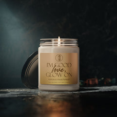 “I’m Good, Love, Glow On” aromatherapy candle from T3 Wellness, shown in three views: lit with a moody background, and unlit with lid on and off. Housed in a glass jar with a beige label and black text, this hand-poured candle features a citrus-forward fragrance blend of juicy orange, melon, pineapple, jasmine, and passionfruit. Designed for emotional grounding, relaxation, and self-care rituals. Available now at teatimewithtoniya.com.